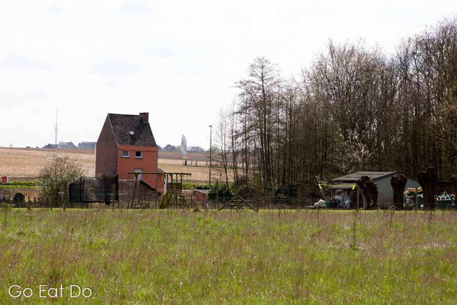 House by pastureland on a spring day near Dilbeek in the Pajottenland, Belgium