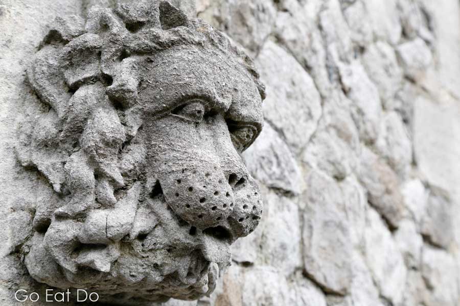 Face of a wild animal depicted in a lion sculpture at Dover Castle, Kent