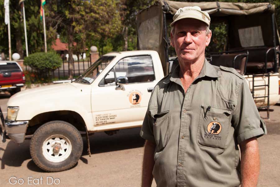 Norman Bourne, the owner of BlackRhino Safaris, by one of his trucks in Bulawayo, Zimbabwer