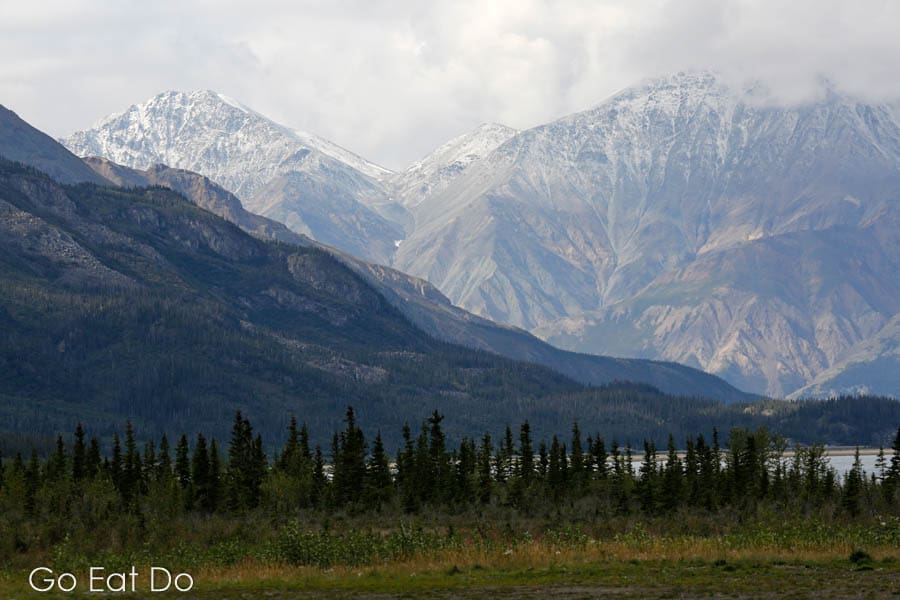 Mountains, forest and a lake in Kluane National Park and Reserve in the Yukon, Canada