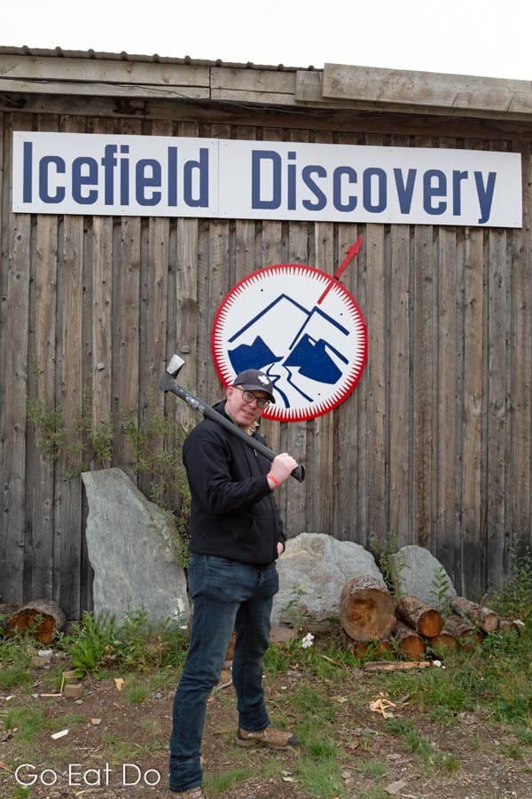Stuart Forster with an axe at Icefield Discovery airstrip in Kluane National Park, the Yukon, Canada