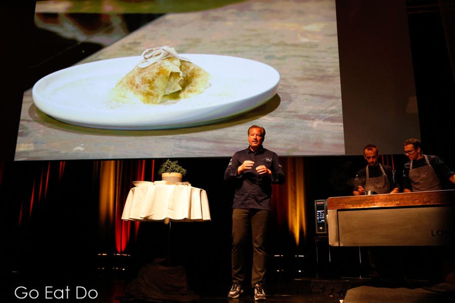 Chef Andreas Doellerer and his sous chefs on stage in the Ferry Porsche Congress Center.