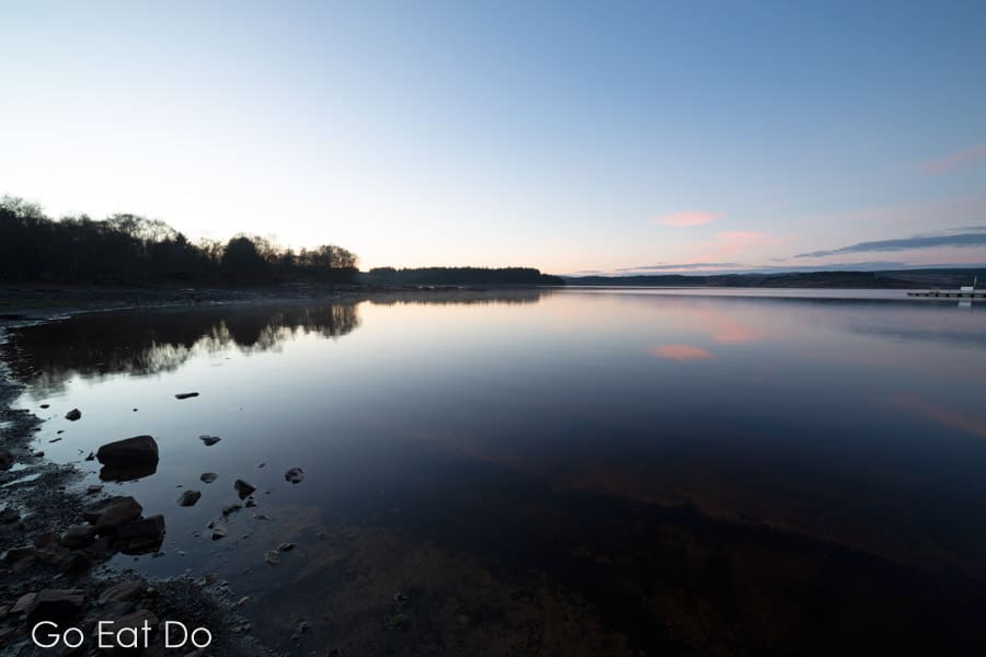 A view out onto the placid surface of Kielder in Northumberland.