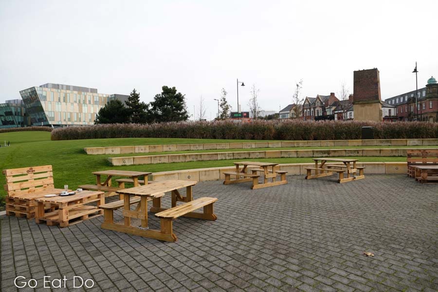Outdoor seating by the amphitheatre at Harton Quays Park close to The Customs House in South Shields