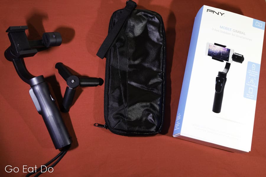 The PNY Mobee Gimbal Stabiliser, tripod-style foot, carrying bag and packaging box.