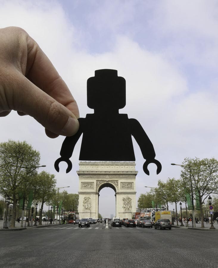 The Arc de Triomphe, in Paris, transformed into a Lego figure. Photo © Paperboyo.