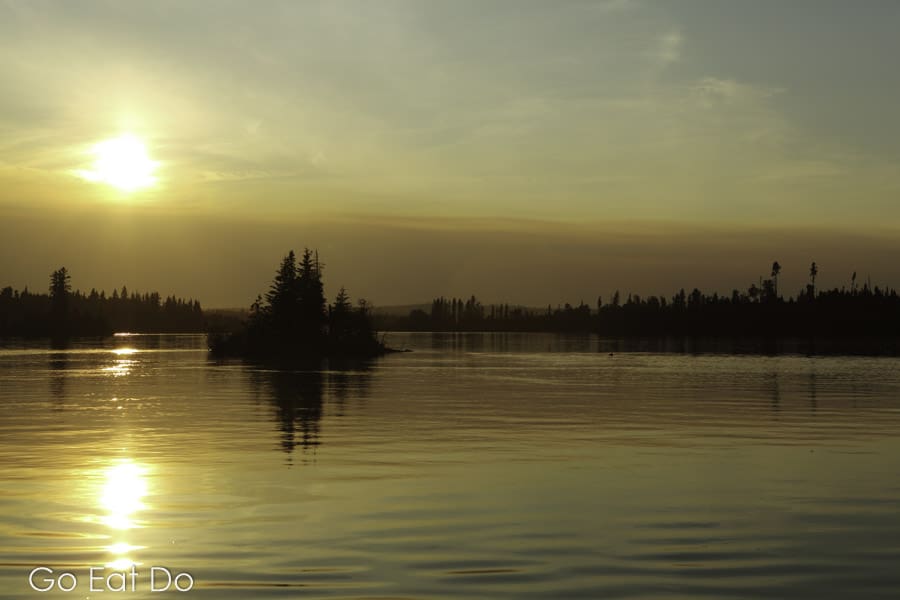Sunset at Otter Lake near Missinipe, a popular destination for fishing trips in Saskatchewan, Canada.