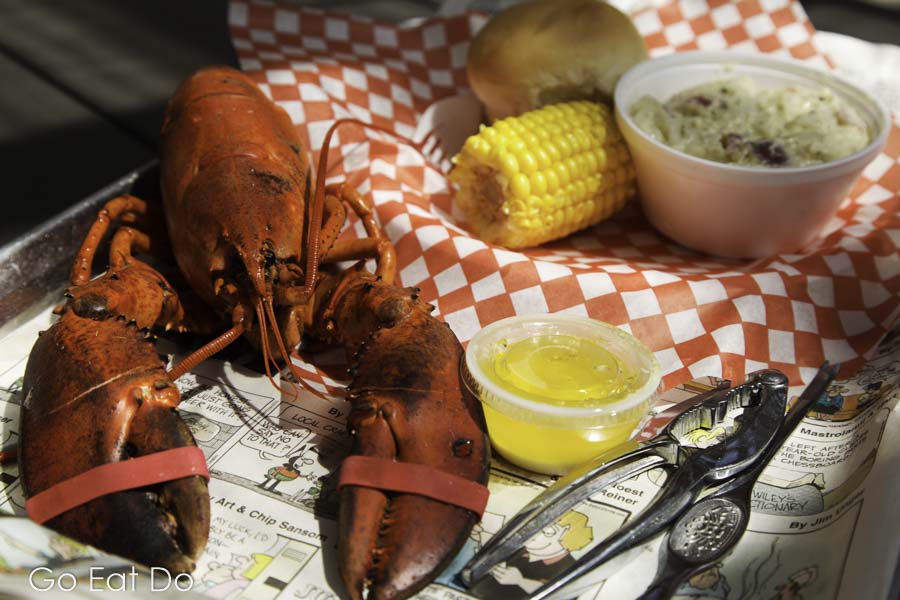 A lobster dinner served with sweetcorn and potato salad at Alma in New Brunswick, Canada