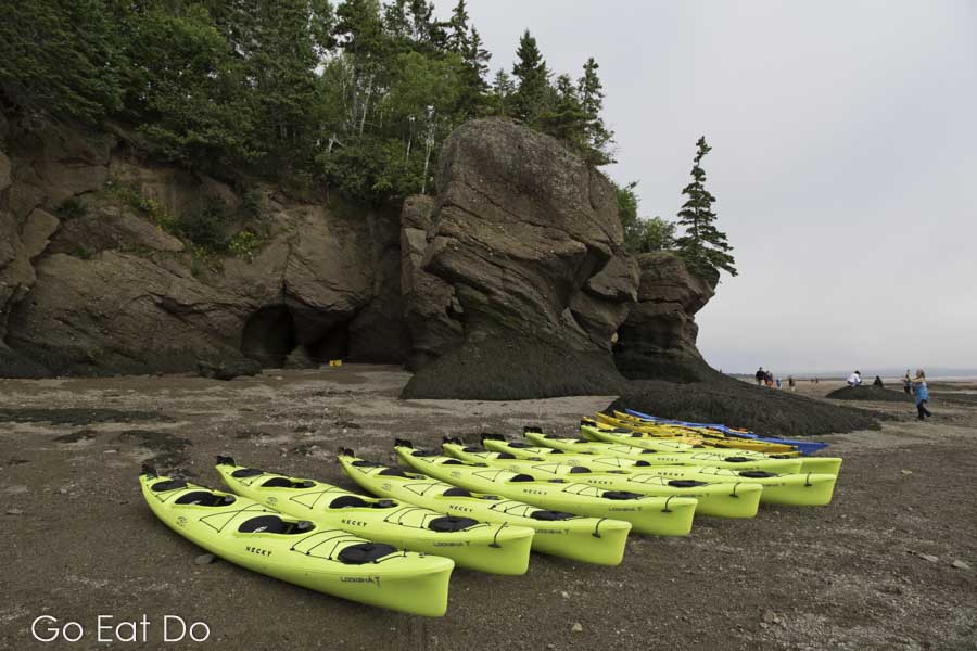 Yellow kayaks by the Hopewell Rocks on the Bay of Fundy scenic drive in New Brunswick, Canada