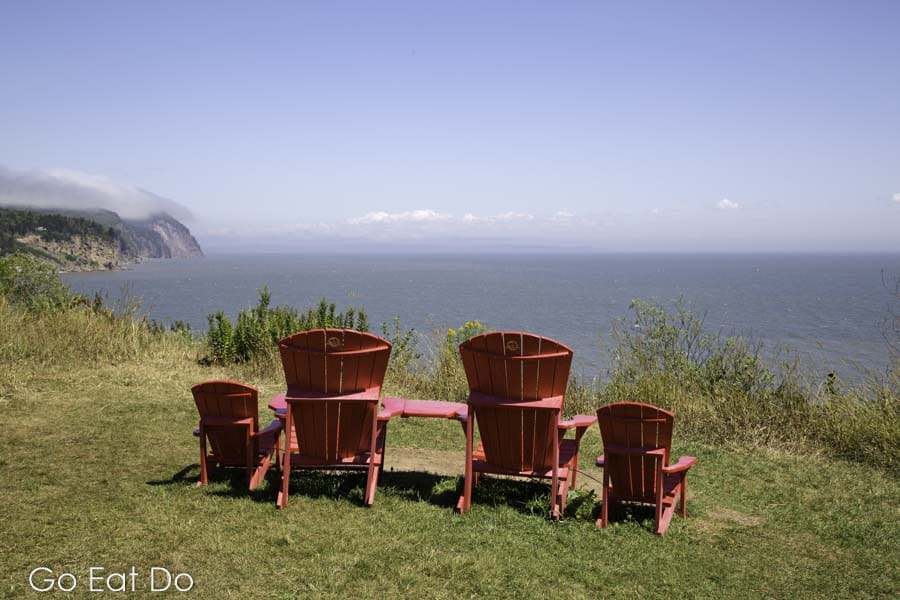 Parks Canada red chairs overlooking the Bay of Fundy at Fundy National Park in New Brunswick