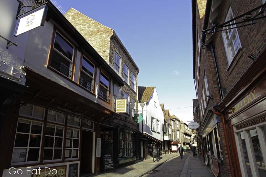 The Shambles, a narrow shopping street of medieval buildings with boutiques and tourist-orientated shops and businesses, in central York