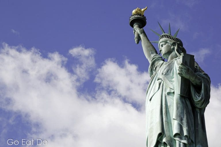 The Statue of Liberty in New York Harbor Go Eat Do