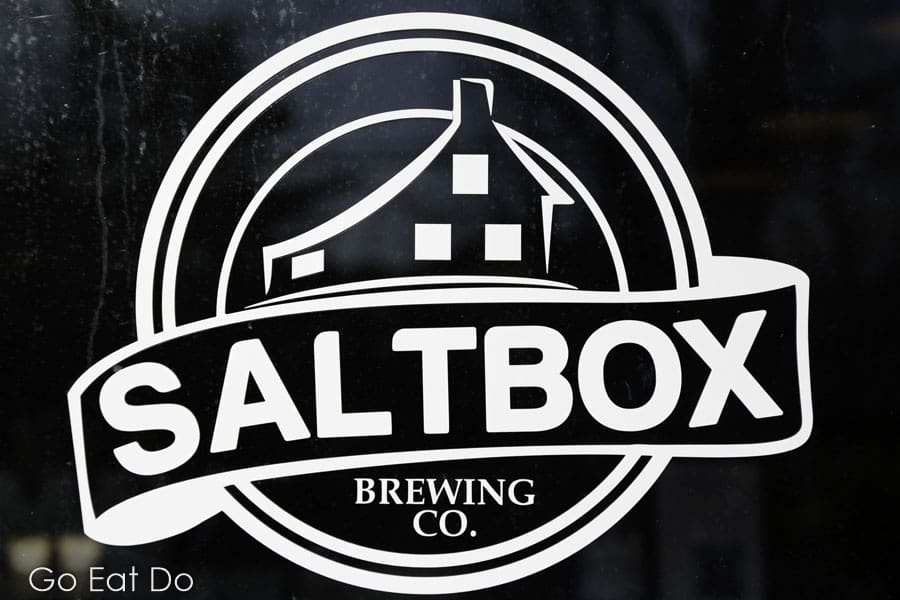 Logo of the Saltbox Brewing Co. on the door of the brewery's tap room in Mahone Bay, Nova Scotia