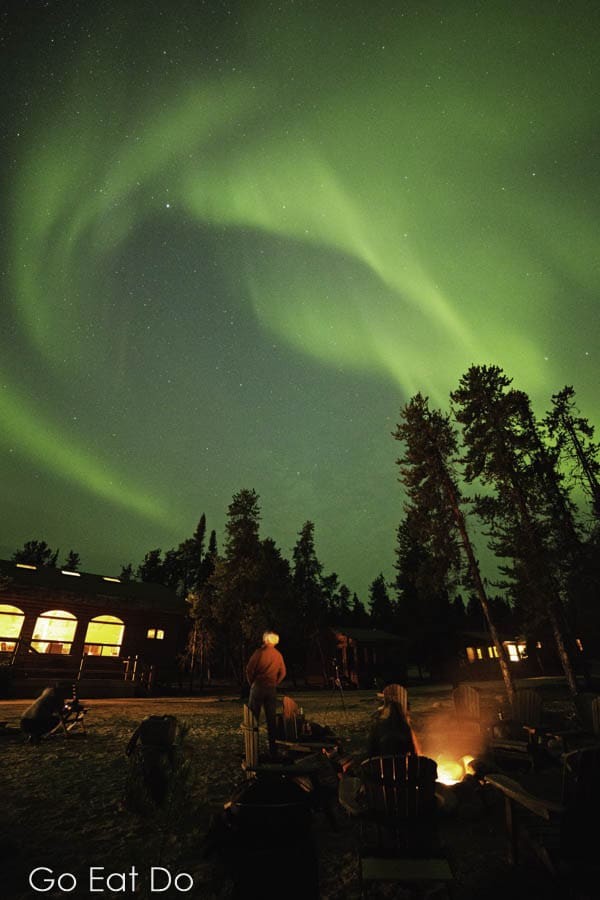 People viewing the northern lights at Gangler's North Seal River Lodge in northern Manitoba, Canada