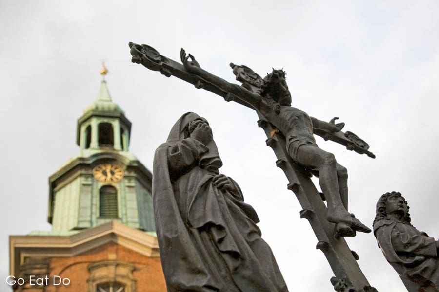 Sculpture of Jesus Christ being crucified on a cross outside of the St Georg Church in St Georg district of Hamburg, Germany.