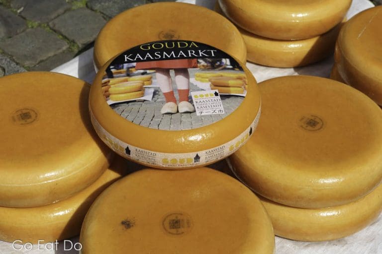 Wheels of cheese for sale at Gouda Cheese Market in Gouda Go Eat Do