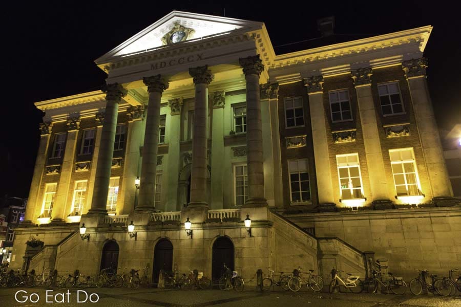 Neoclassical facade of the City Hall (Stadhuis), seen at night in Groningen, the Netherlands