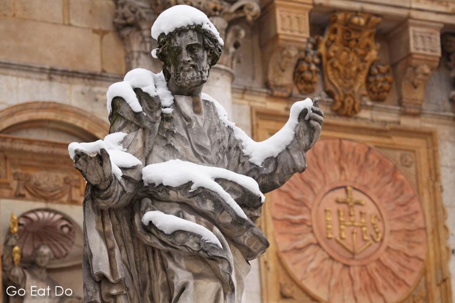 Snow on a statue of one of the 12 disciples outside of the Church of Saints Peter and Paul in Krakow, Poland
