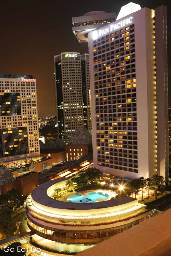 Five-star Pan Pacific Hotel, at night, at Marina Bay in Singapore