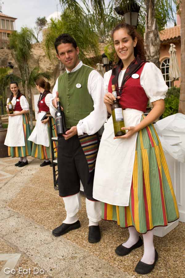 Waiters and waitresses wearing traditional Canarian costumes