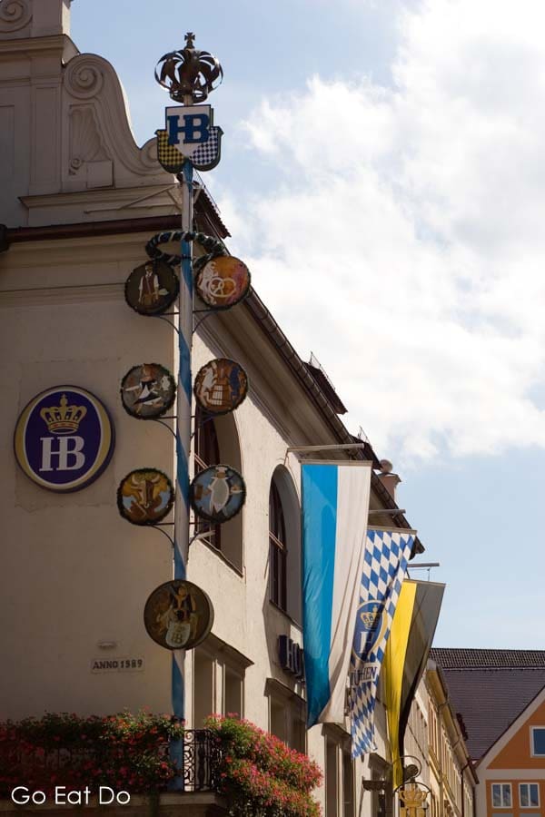 Flags fly outside of the Hofbrauhaus, the popular beer hall, in Munich, Germany