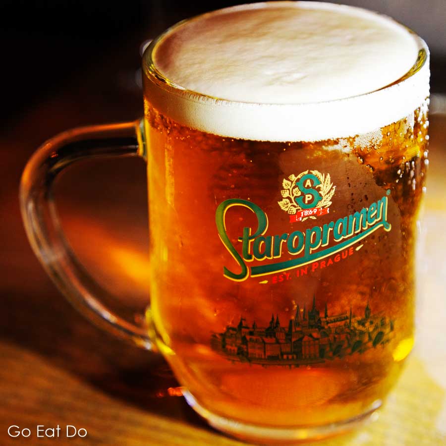 Pint glass of Czech Staropramen beer