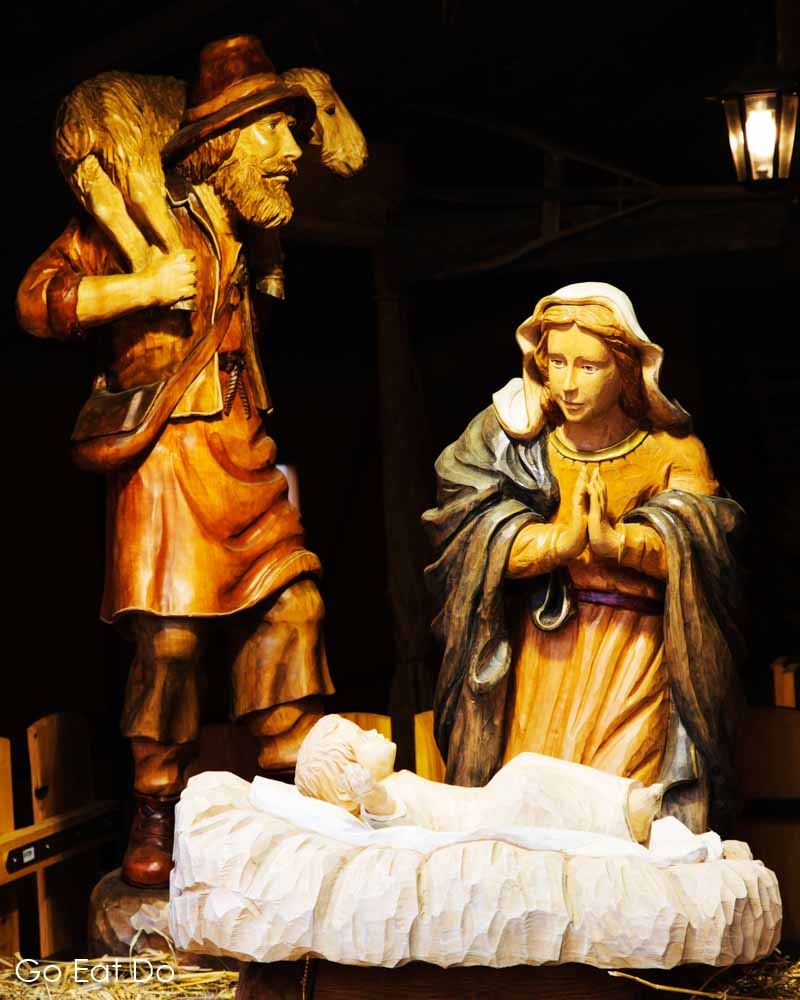 Wooden crib figures depicting the Virgin Mary and Baby Jesus at Esslingen Christmas market near Stuttgart, Germany