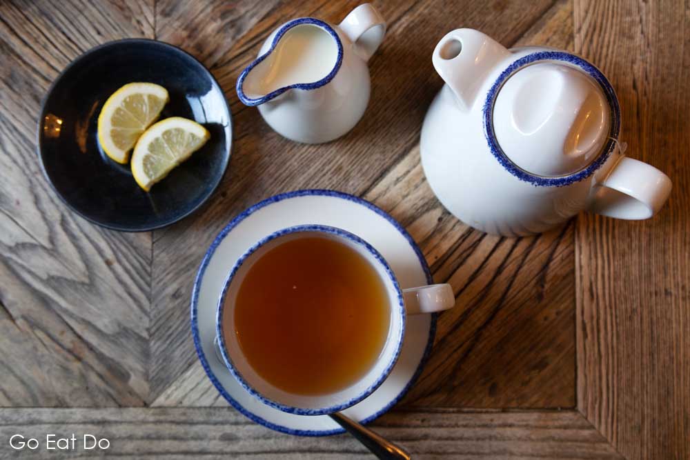 A cup of Earl Grey tea served with slices of lemon at The Cookie Jar's Bailiffgate Bistro