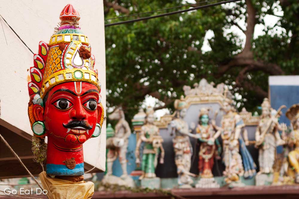 A colourful mask by a Hindu temple in Bengaluru, India