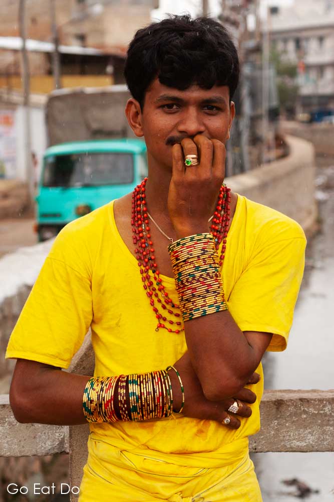 A man shows off the bangles he wears for the annual firewalking festival in Bengaluru, India