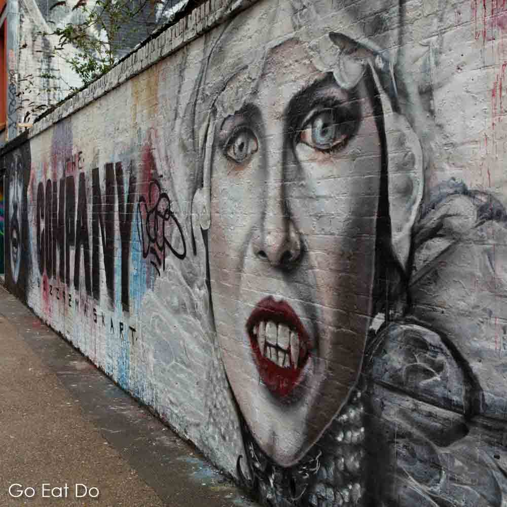 Vampire-like street art in the Shoreditch district of London spotted during an East London walking food tour led by one of Eating Europe's guides