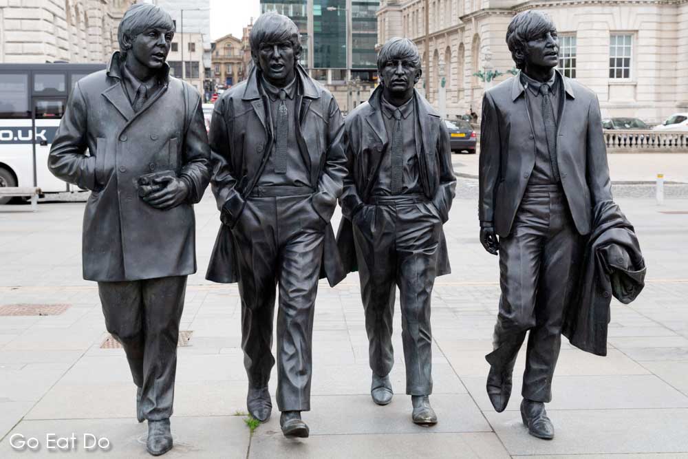 The Beatles Statue sculpted by Andrew Edwards, depicting Paul McCartney, George Harrison, Ringo Starr and John Lennon at the Pier Head in Liverpool, England
