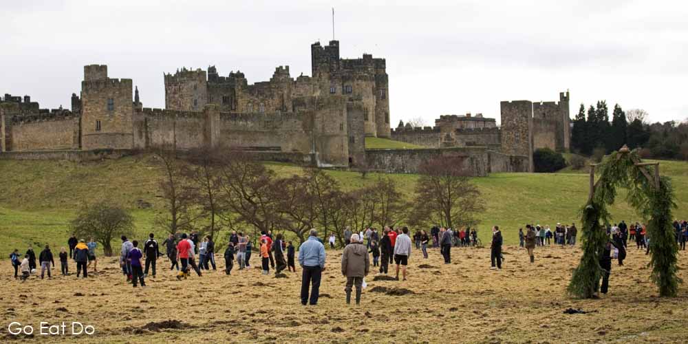 Traditional Shrovetide Tuesday football match between residents of the St Paul's and St Michael's parishes by Alnwick Castle in Northumberland.