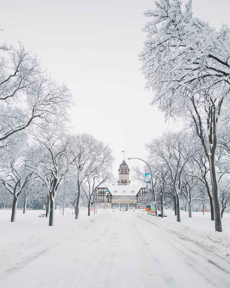 View along a snowy lane to Assiniboine Park Zoo, one of the top attractions and things to do in Winnipeg in winter