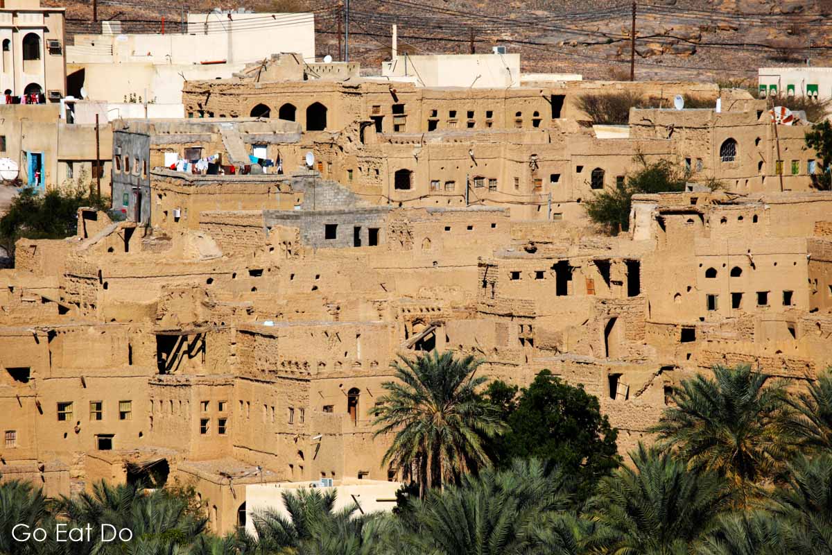 The red, earth coloured houses of the Omani village of Al Hamra near Nizwa, has no defences and is surrounded by lush plantations thanks to its system of falaj irrigation canals