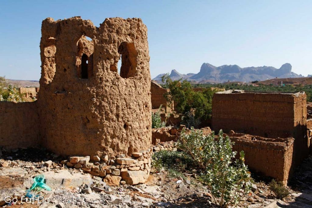 Ruins of a red, earth coloured tower in the Omani village of Al Hamra