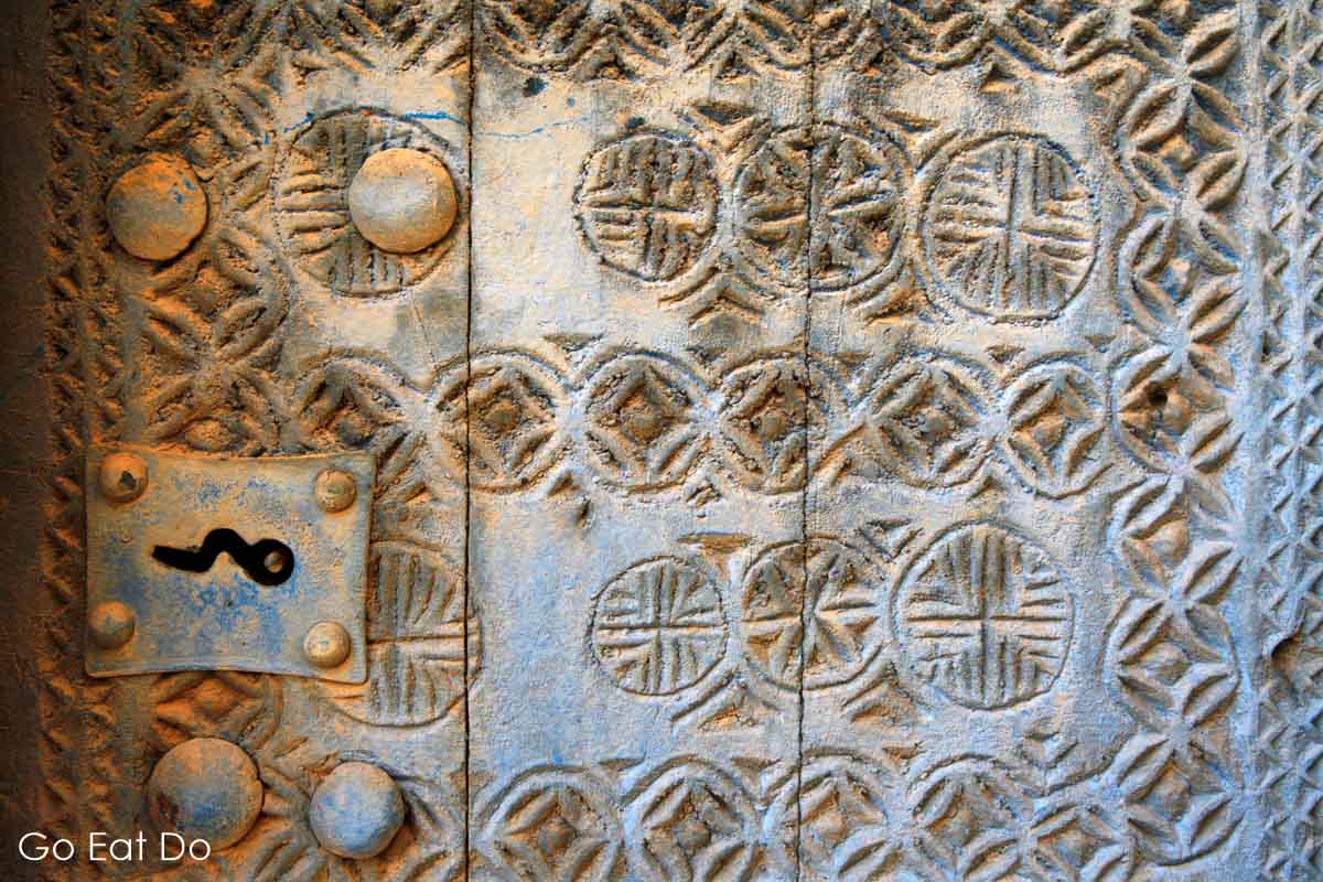 Detail of a traditional carved door in the village of Al Hamra, Oman