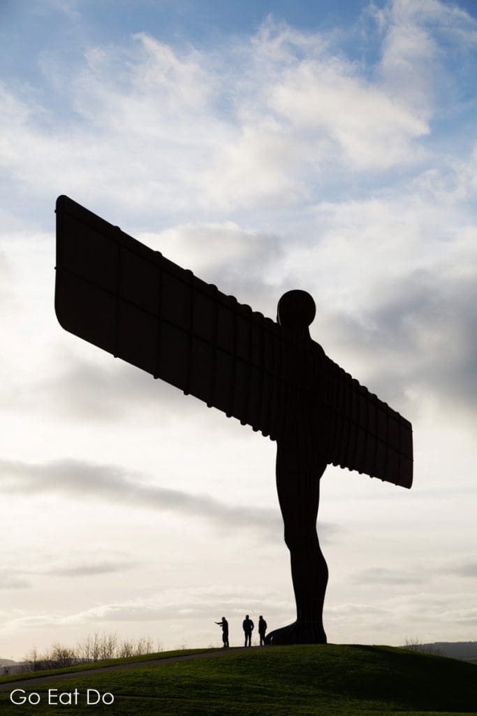 People visiting the Angel of the North, the sculpture by Antony Gormley that stands in Gateshead