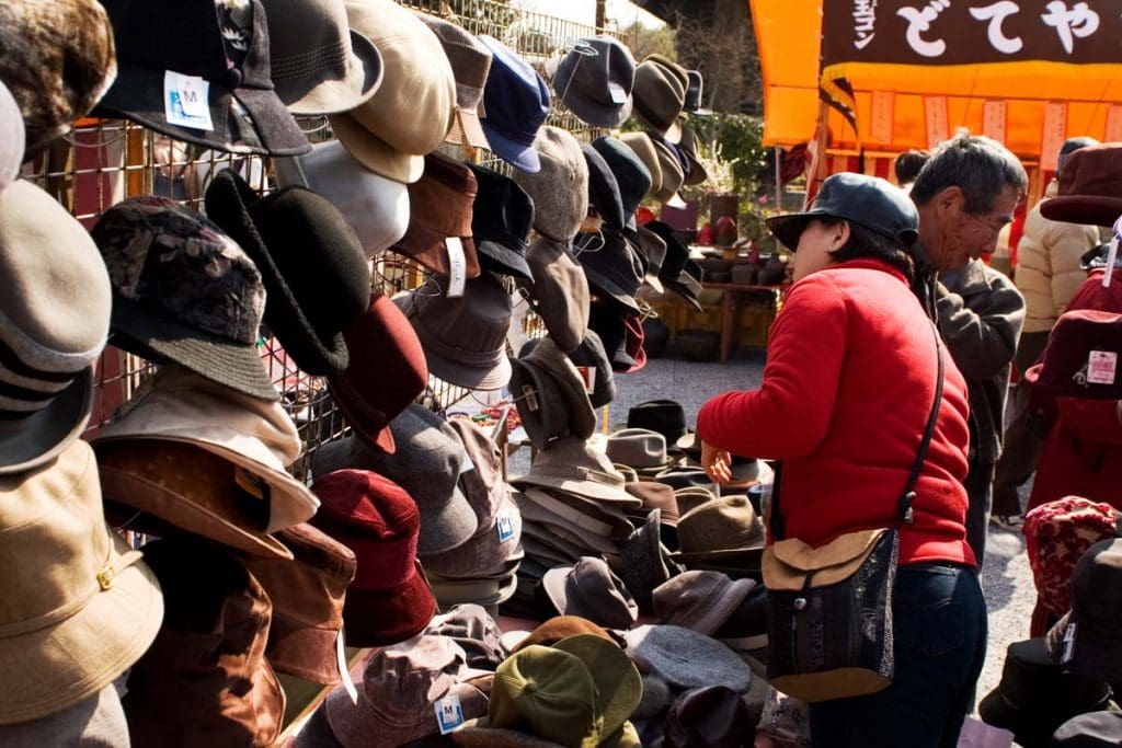 Hats offered for sale at Kyoto's monthly Kobosan market