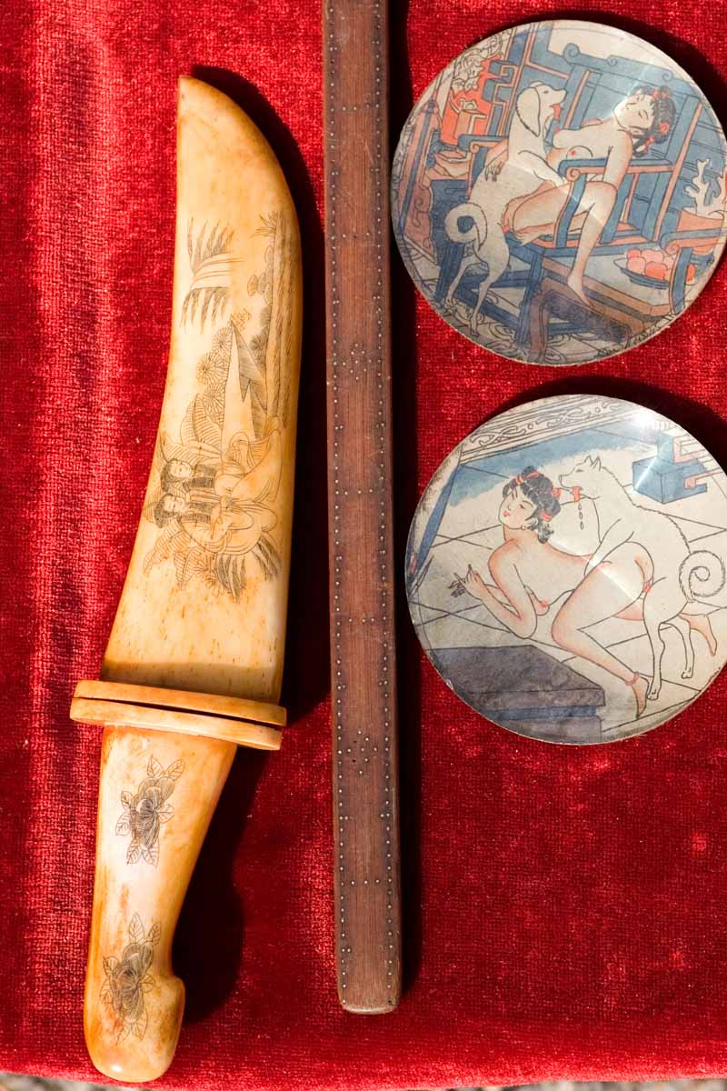 A knife among antiques on sale at the Kobo-san flea market at the Toji Temple in Kyoto, Japan
