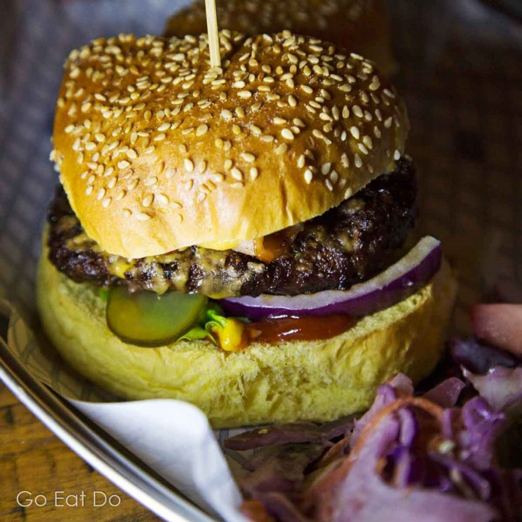 A gourmet burger served on a wooden board during Sunderland Restaurant Week.