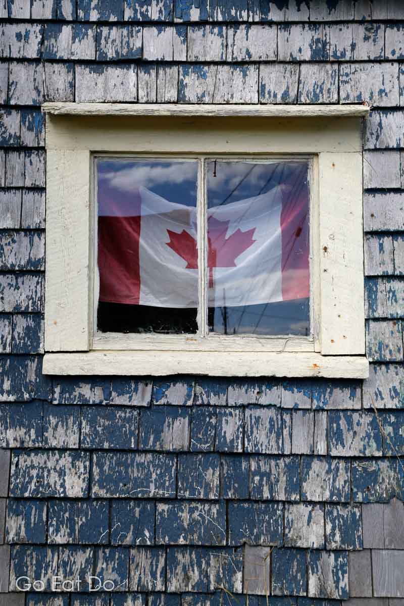 The maple leaf of a Canadian flag in a rustic house in Nova Scotia