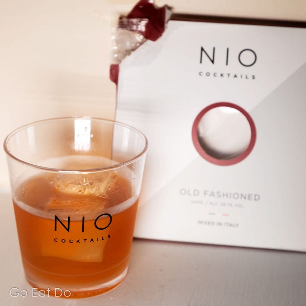 A pre-mixed Old Fashioned from NIO Cocktails in a branded tumbler