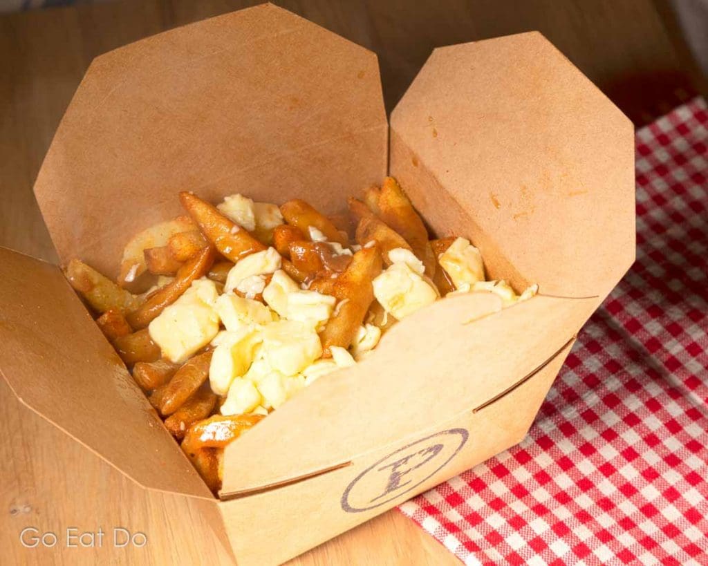 Curds and gravy on chips, the holy trinity of ingredients that are served as poutine