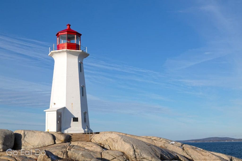 The lighthouse at Peggy's Cove photographed on a sunny winter day in Nova Scotia, Canada.