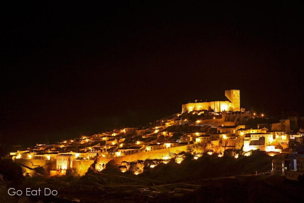 The castle and walled city of Mertola seen at night.