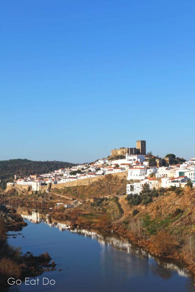 Walled medieval city of Mertola is guarded by a stone fortress and overlooks the River Guadiana in the Alentejo, Portugal.