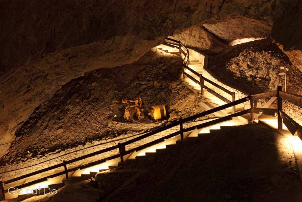 Illuminated walkways and mining equipment in the salt mine at Bex, Switzerland. The mine has been producing salt since the Middle Ages.