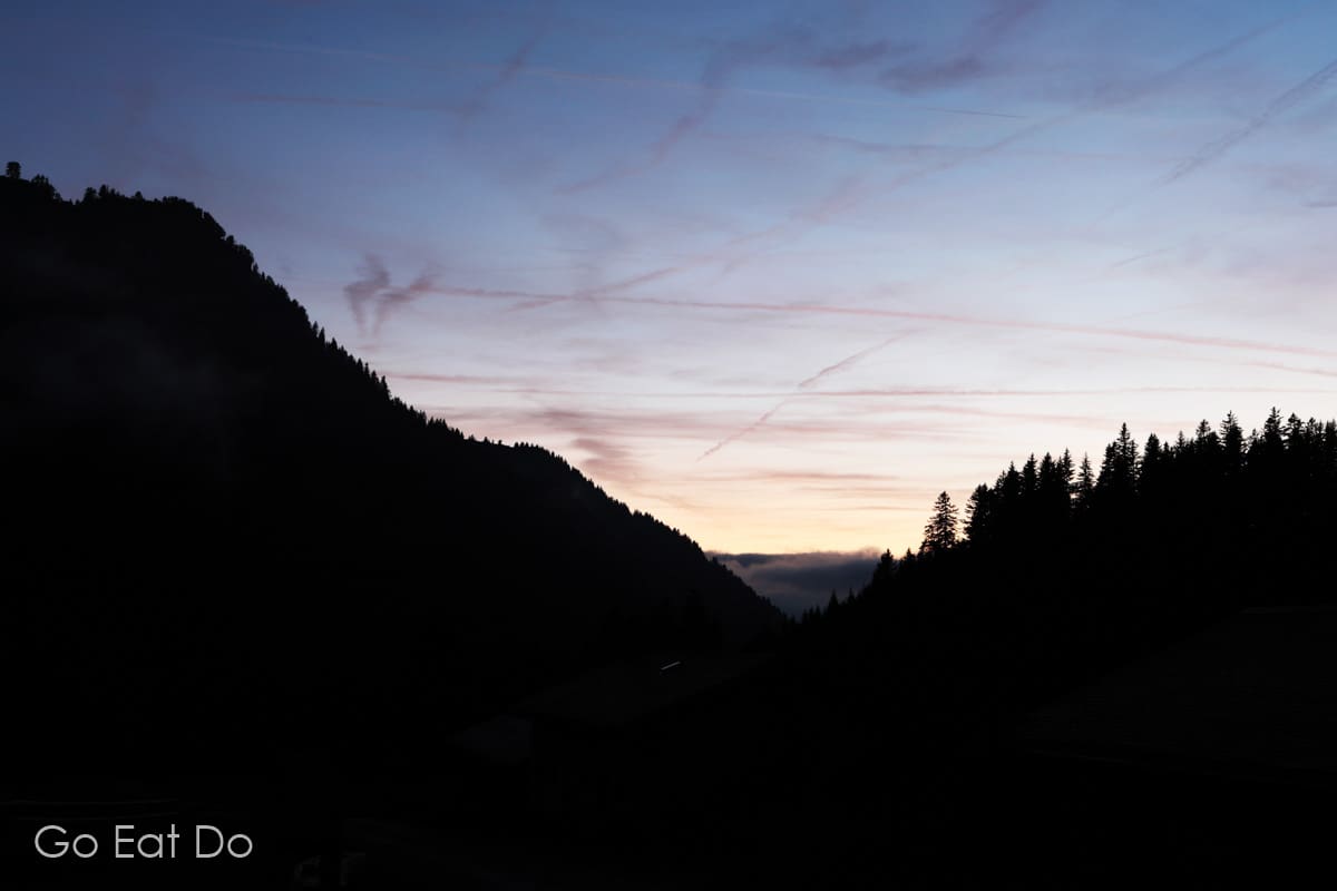 Dusk in a Swiss mountain valley seen from the village of Solalex near Villars, Switzerland.