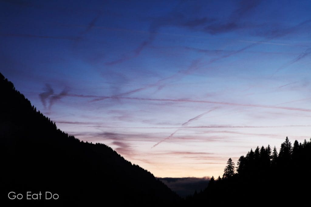 Dusk in a Swiss mountain valley seen from the village of Solalex at Villars, Switzerland.